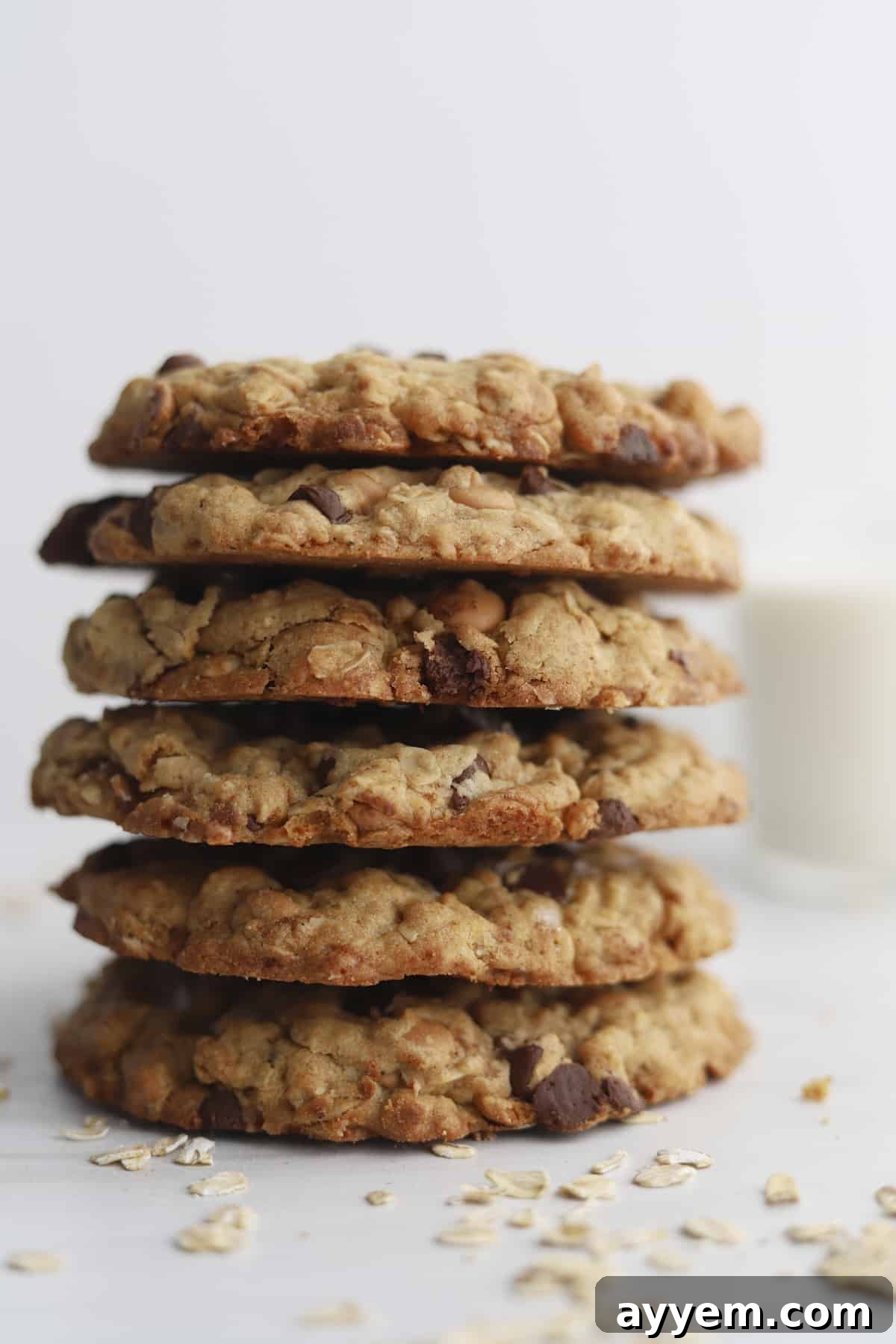 A stack of six delectable copycat Crumbl Mom's Cookies, rich with frosting.