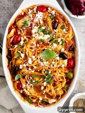 Oven baked Mediterranean spaghetti with briny olives and tangy artichokes.