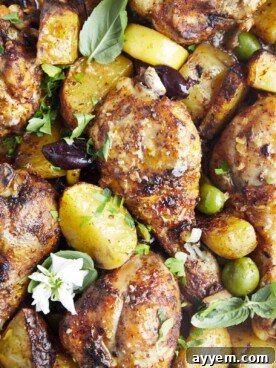 Baked chicken drumsticks with potatoes.