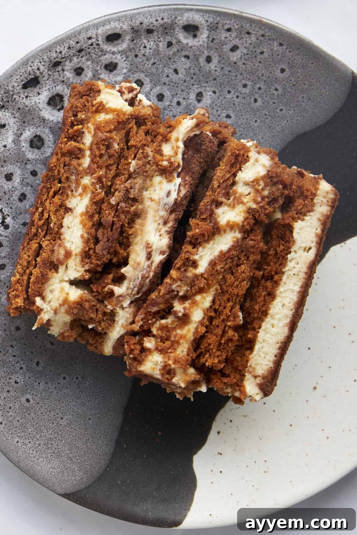 Close up image of a slice of Biscoff tiramisu on a plate. 