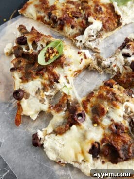 Deliciously sliced Feta Gyro Pizza with creamy feta, savory gyro meat, and fresh herbs