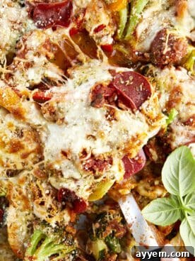 Sheet pan veggie pizza with various colorful vegetables