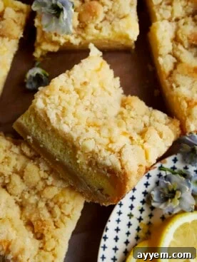 Easy Lemon Cheesecake Bars with a shortbread crust and crumbly topping