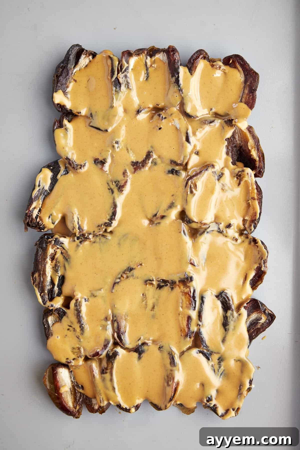 The Viral Date Bark Sensation 3 A layer of split dates topped with peanut butter.