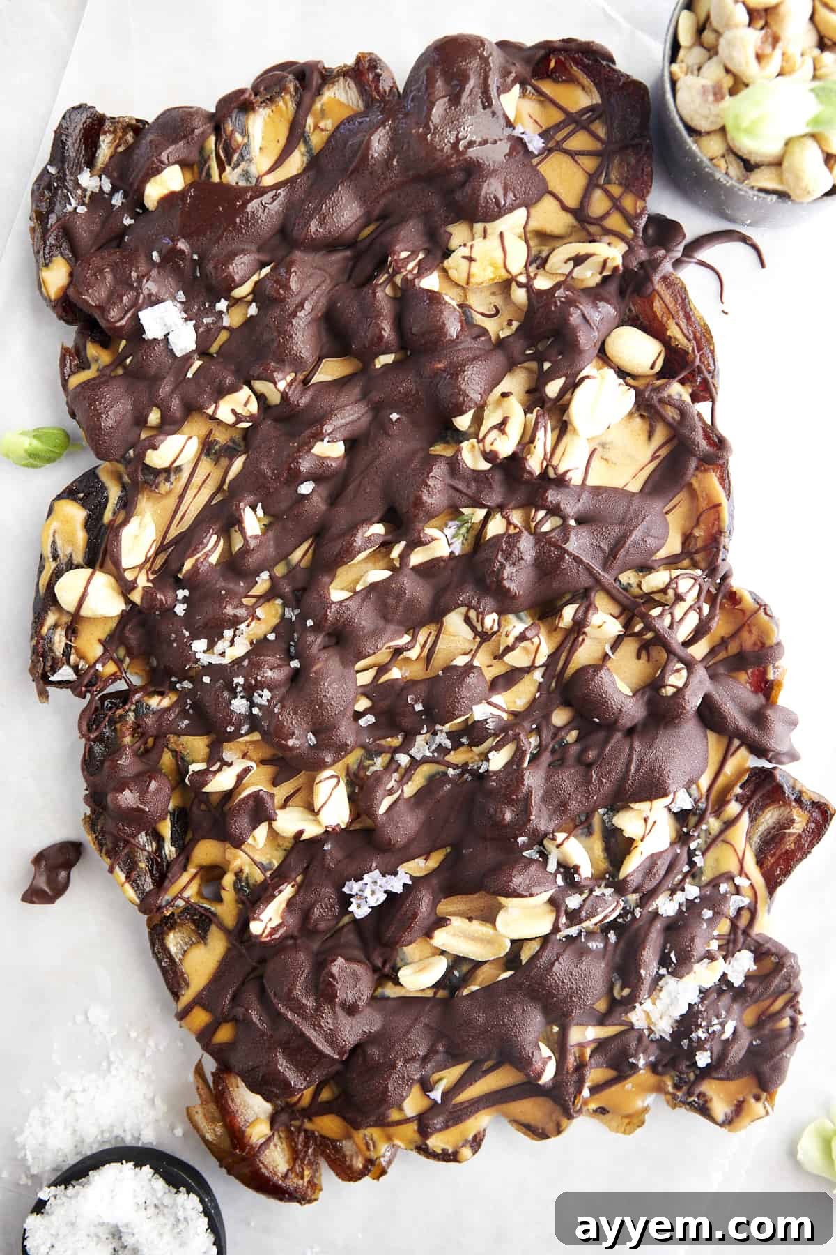A slab of Snickers date bark topped with flakey salt.