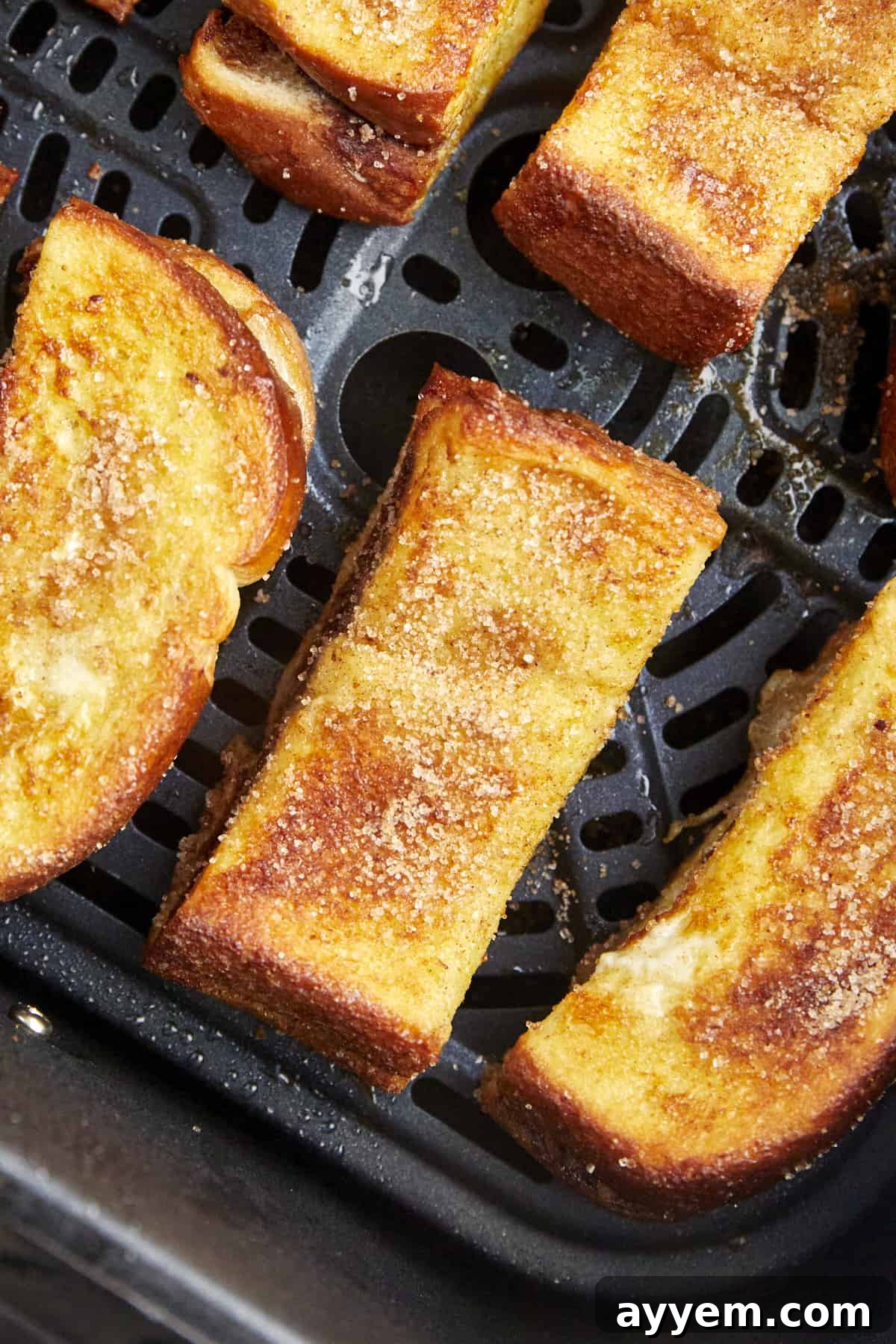 Nutella French toast sticks in an air fryer basket. 