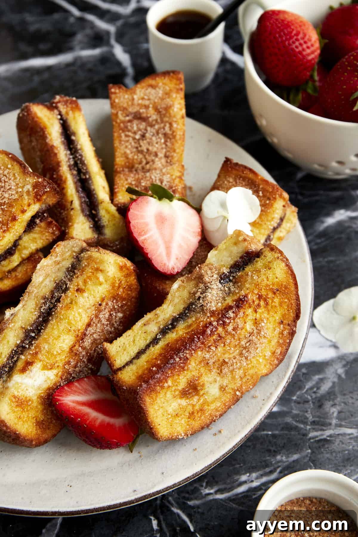 Cinnamon sugar Nutella French toast sticks on a plate. 