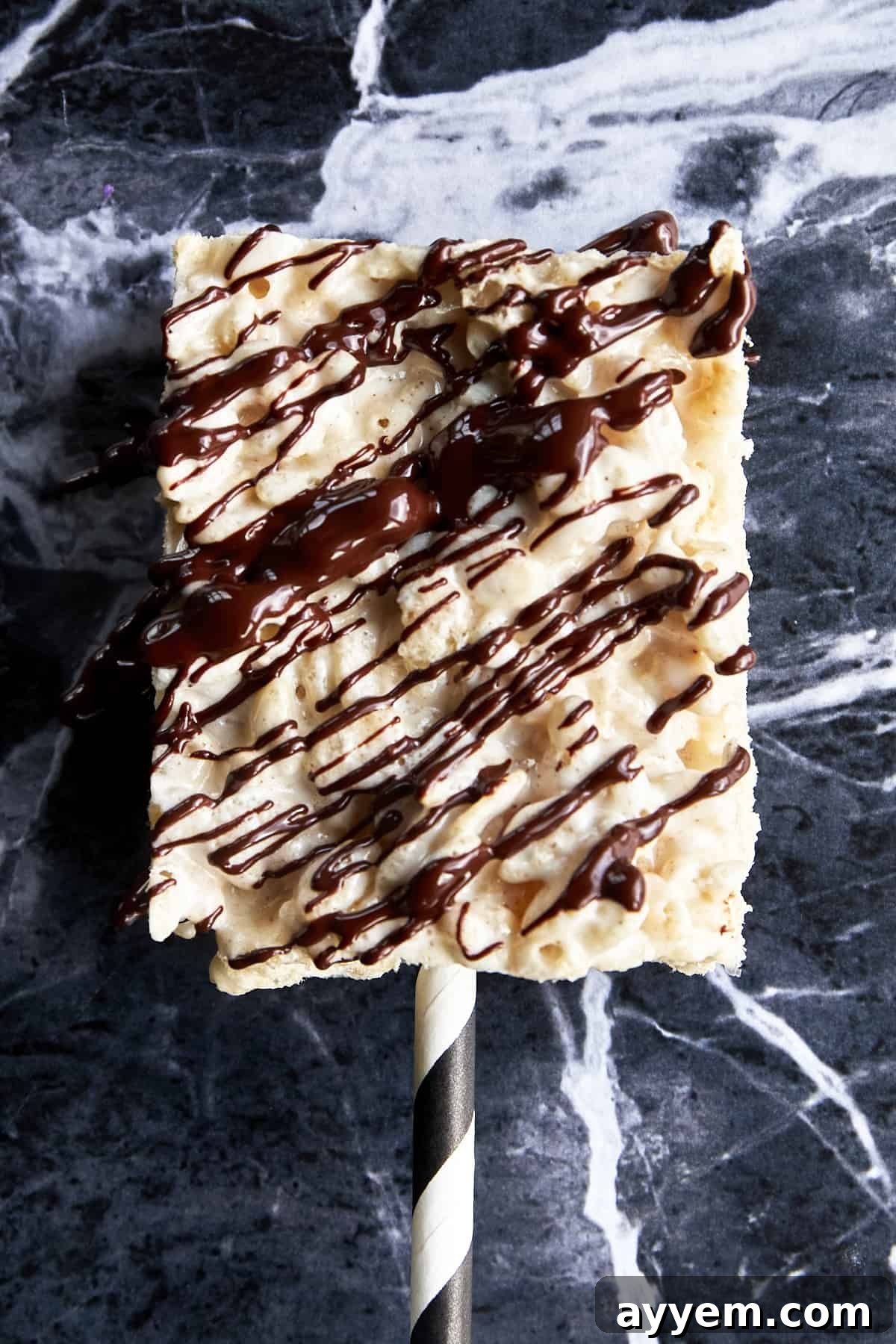 Chocolate drizzled over a rice krispie treat.