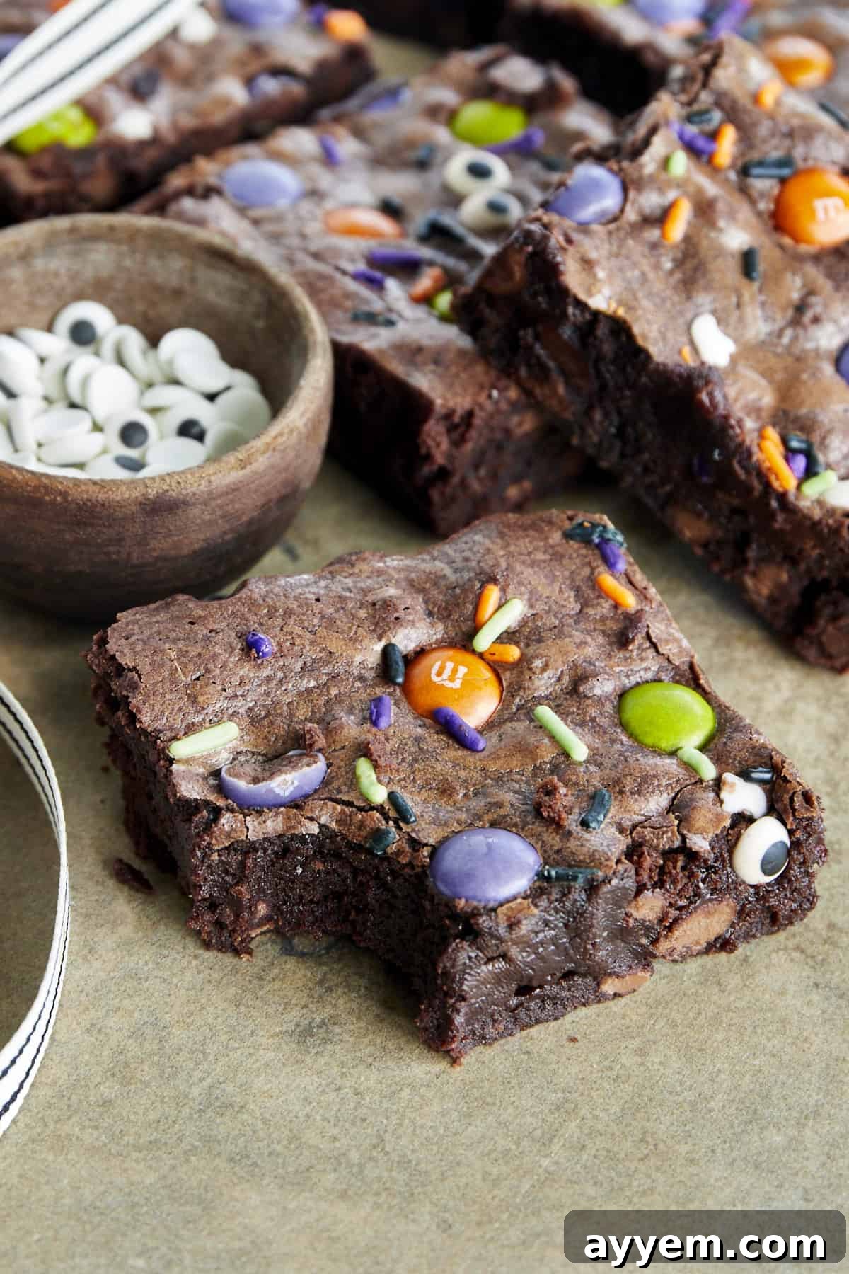 A Halloween brownie with a bite missing from the corner. 