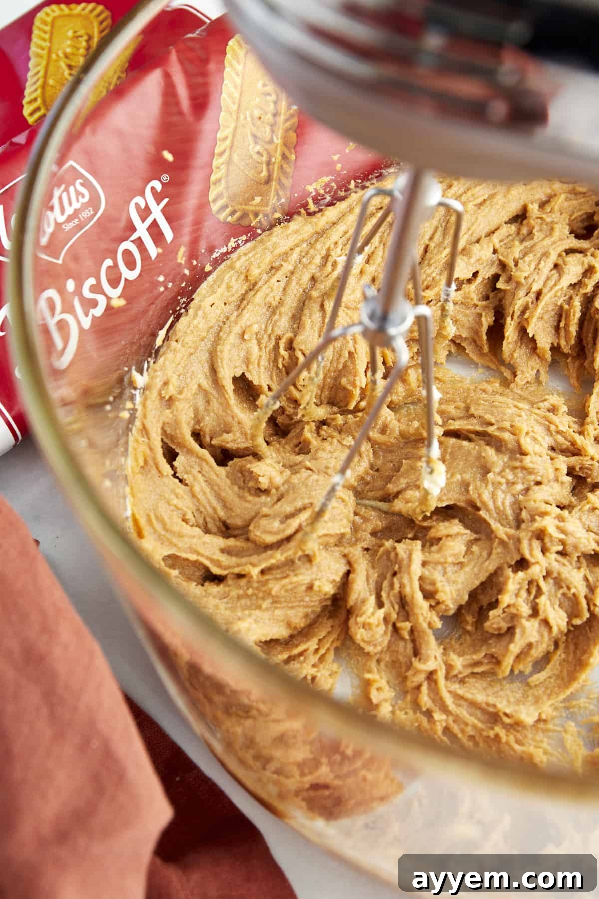 A stand mixer combining the creamed Biscoff cookie dough ingredients.