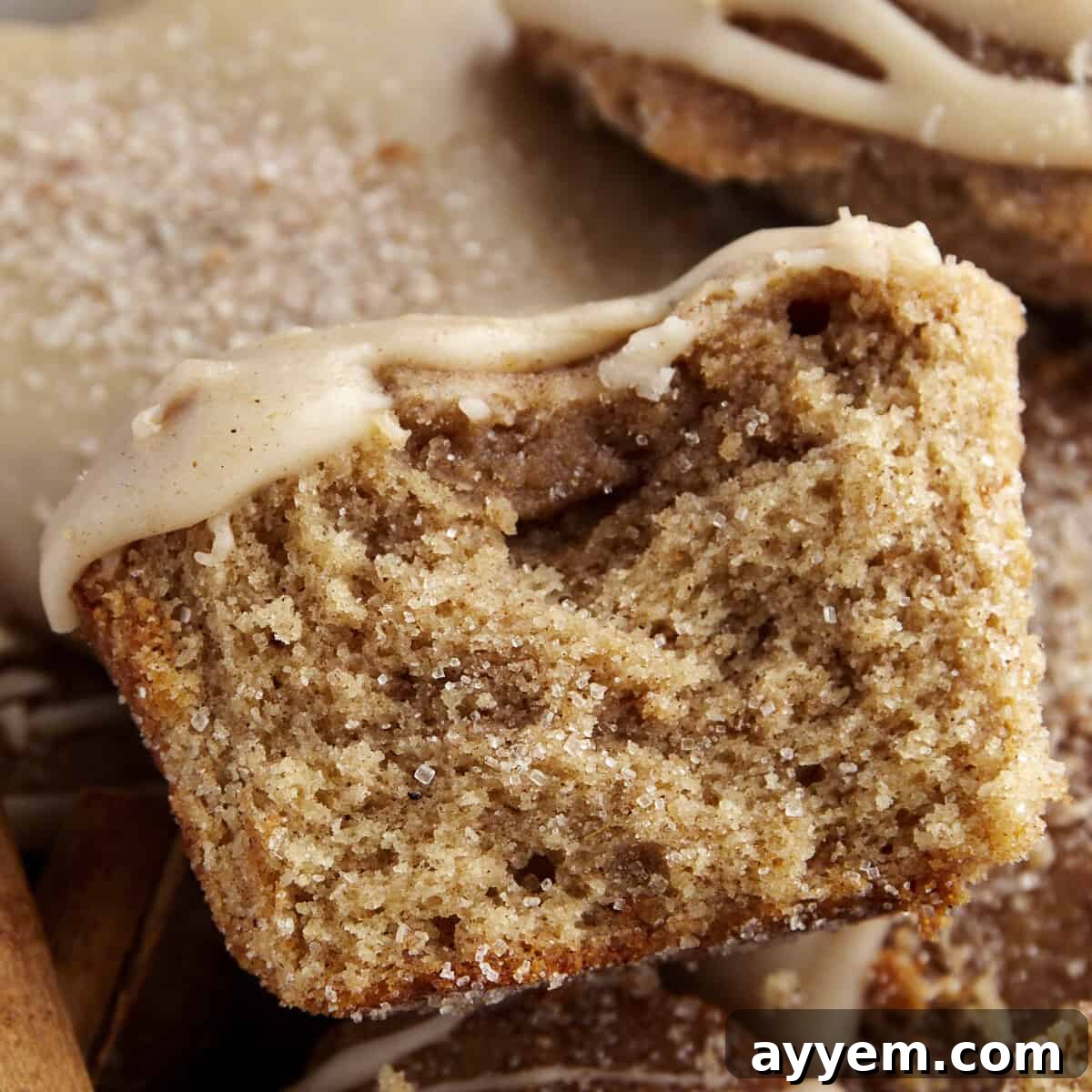 Half of a maple glazed apple cider muffin.