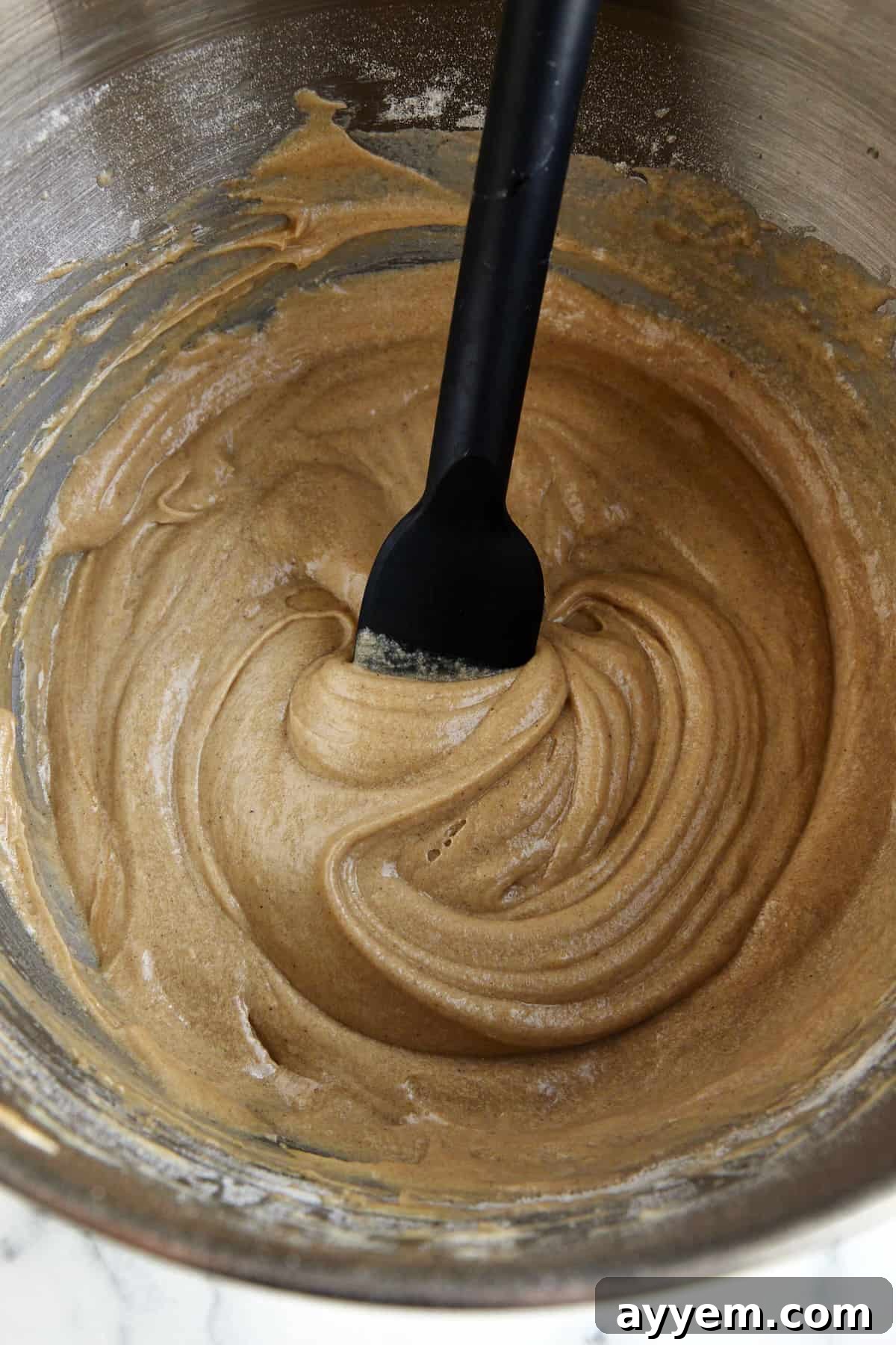 Apple cider muffin batter in a bowl. 
