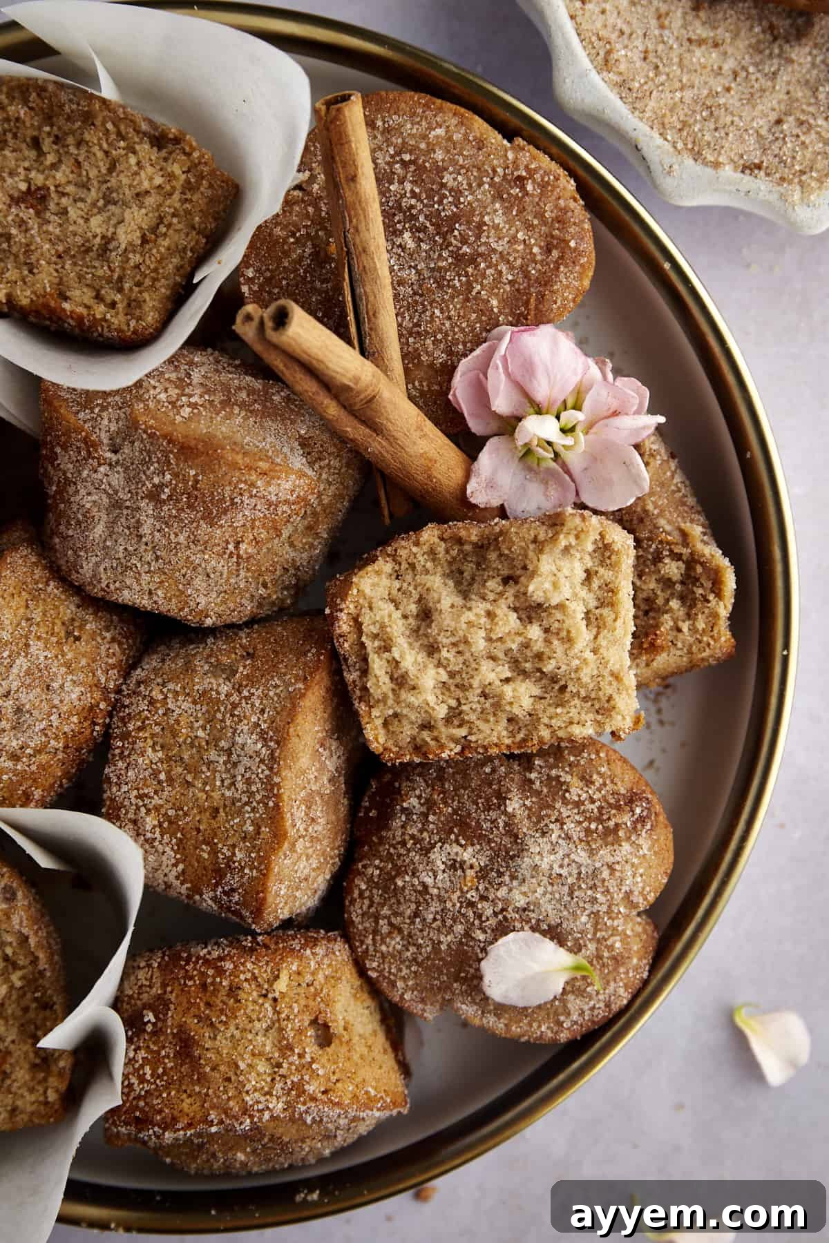 A plate of baked apple cider muffins. 