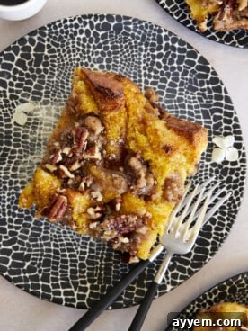 A beautiful Pumpkin French Toast Casserole, elegantly garnished with a sweet streusel topping, ready to be served for a festive and comforting fall brunch.