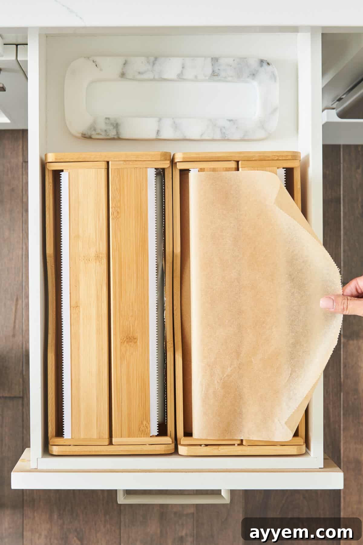 A custom dispenser system neatly organizing parchment paper, highlighting innovative solutions for commonly used kitchen wraps.