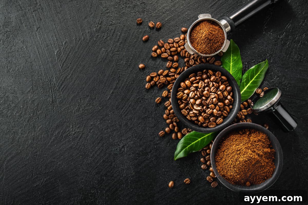 coffee beans and ground coffee in bowls on black background.