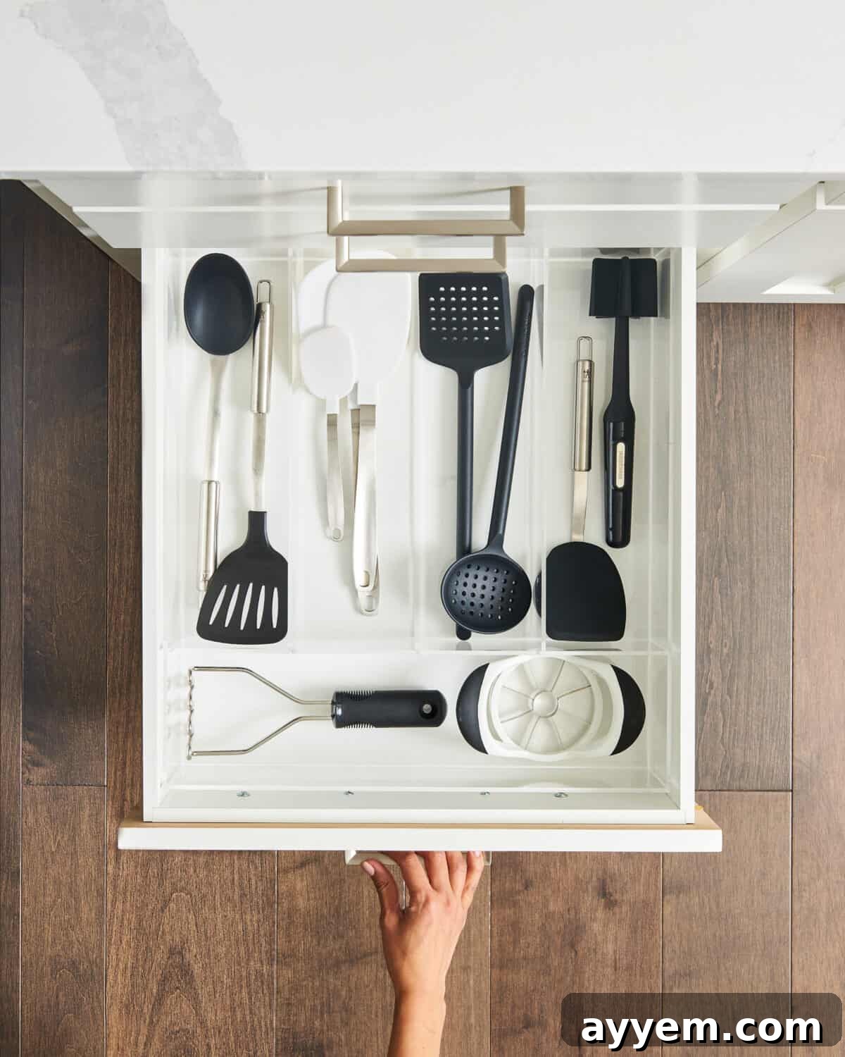 spatulas and other kitchen tools in a drawer.