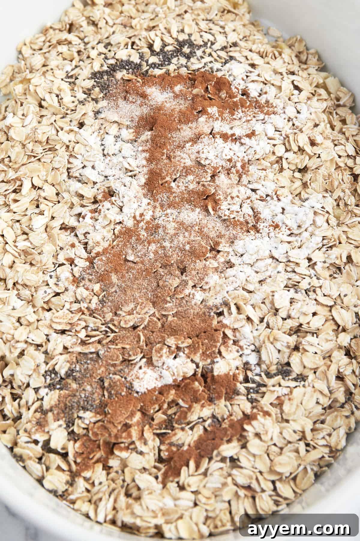 Dry ingredients for baked apple oatmeal in a baking dish. 