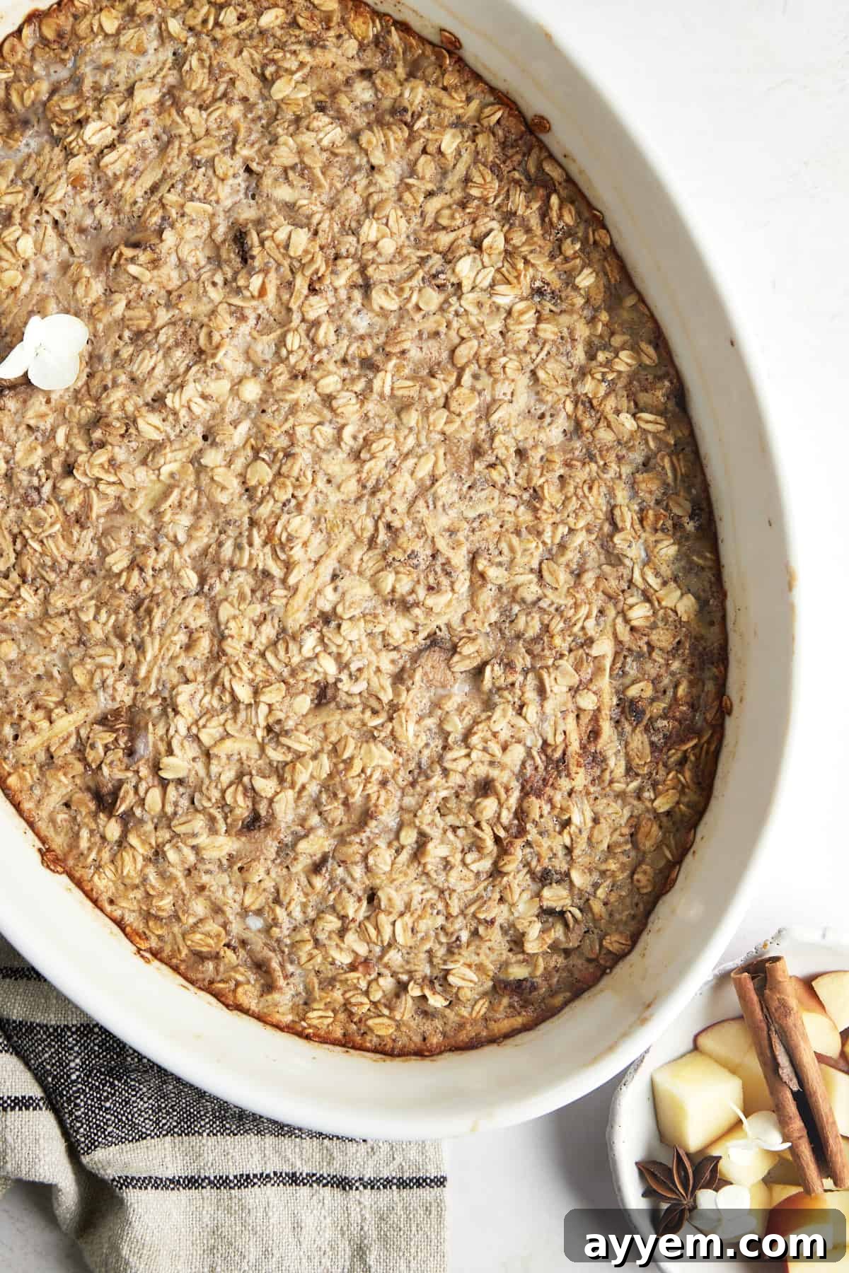 Baked apple oatmeal in an oval baking dish. 