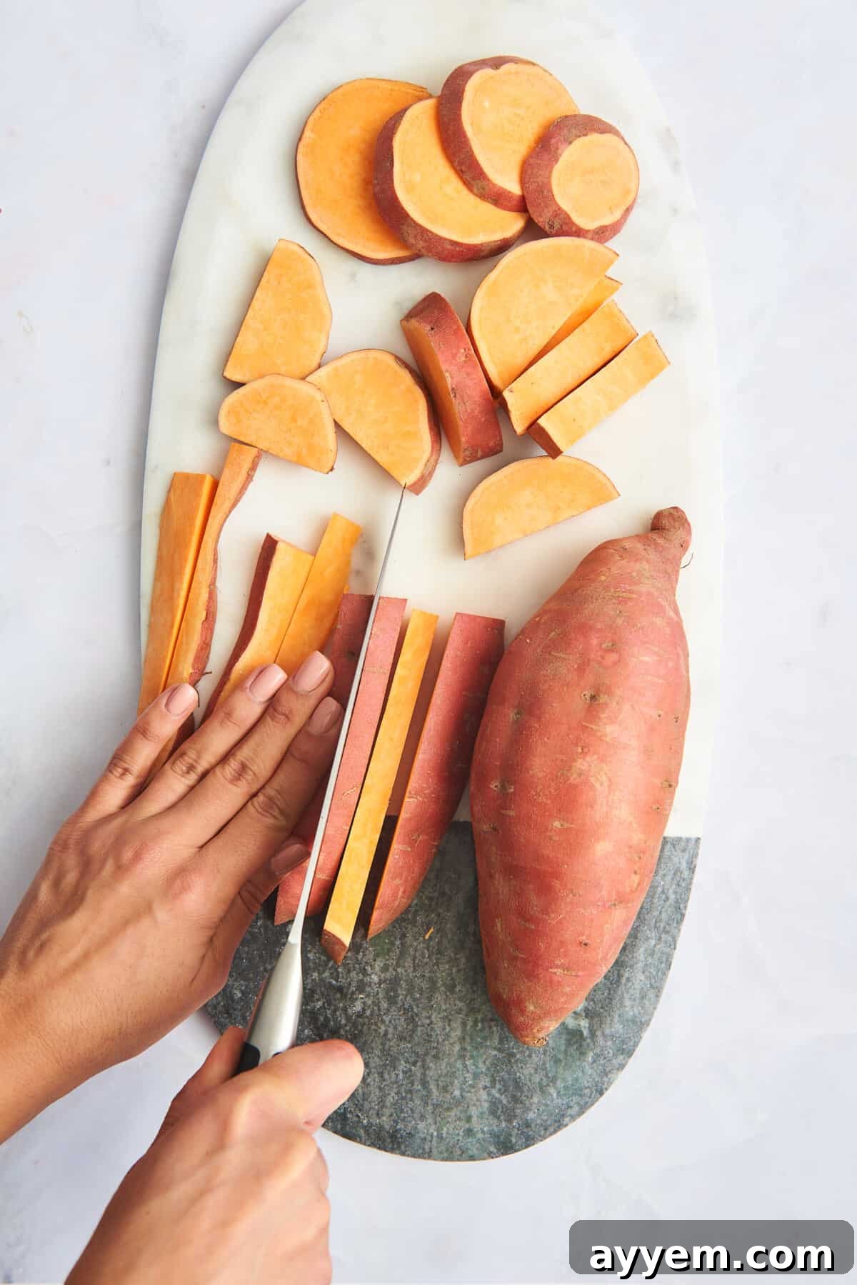 Assortment of sweet potato cuts: rounds, quarters, and sticks, alongside a whole sweet potato.