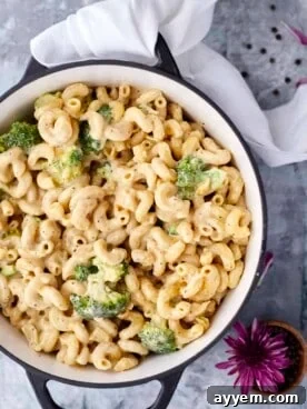 An inviting overhead view of a pot filled with cheesy one-pot broccoli mac and cheese, ready to be served.
