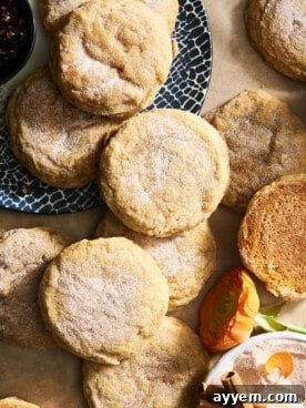 Soft, sugar-coated pumpkin cookies arranged enticingly, capturing the essence of fall.