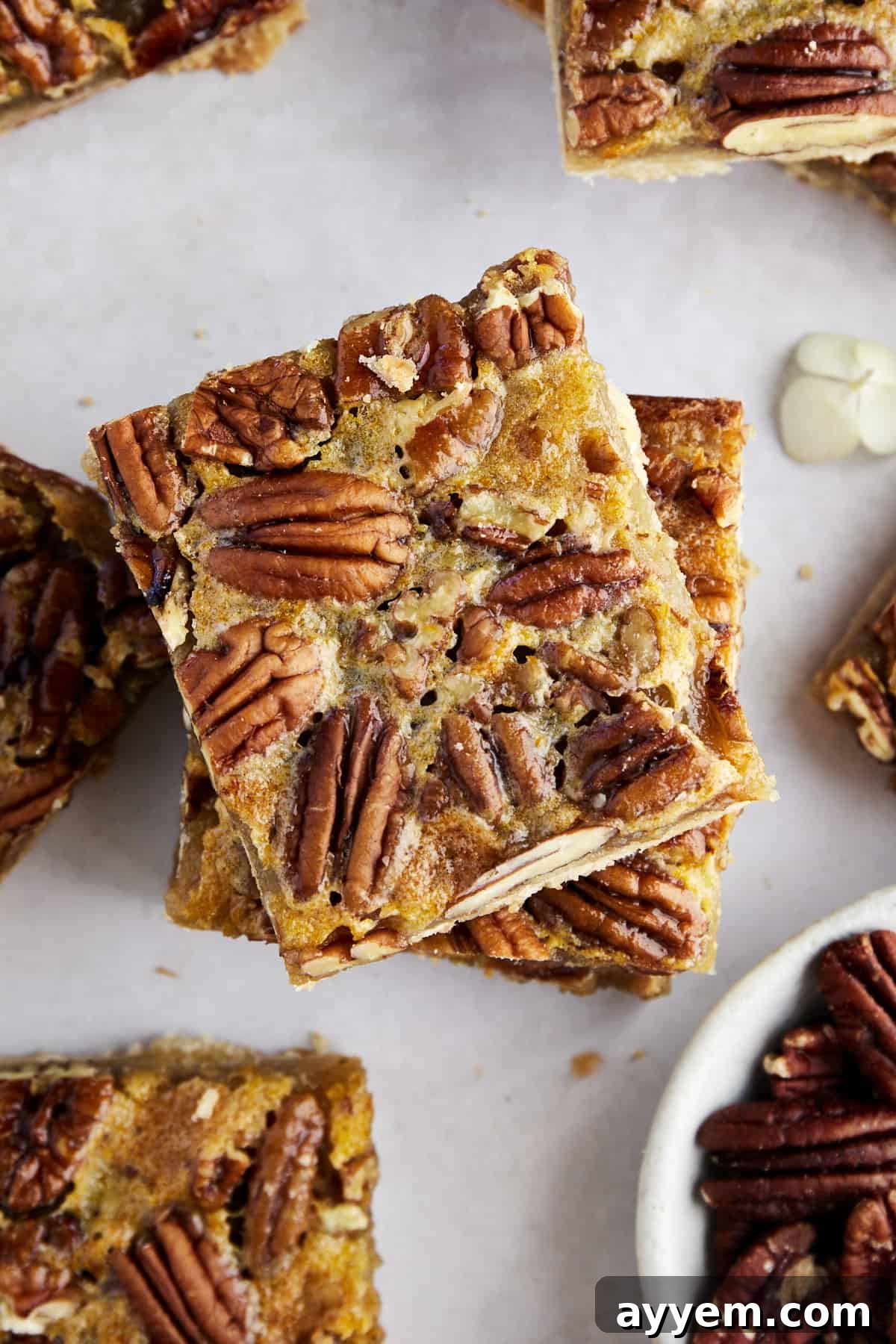 A stack of perfectly baked easy pecan pie bars, ready to be enjoyed.