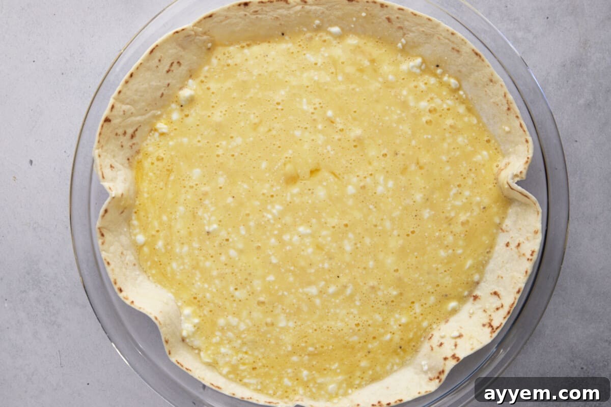 Whisked egg and cottage cheese mixture over a tortilla.
