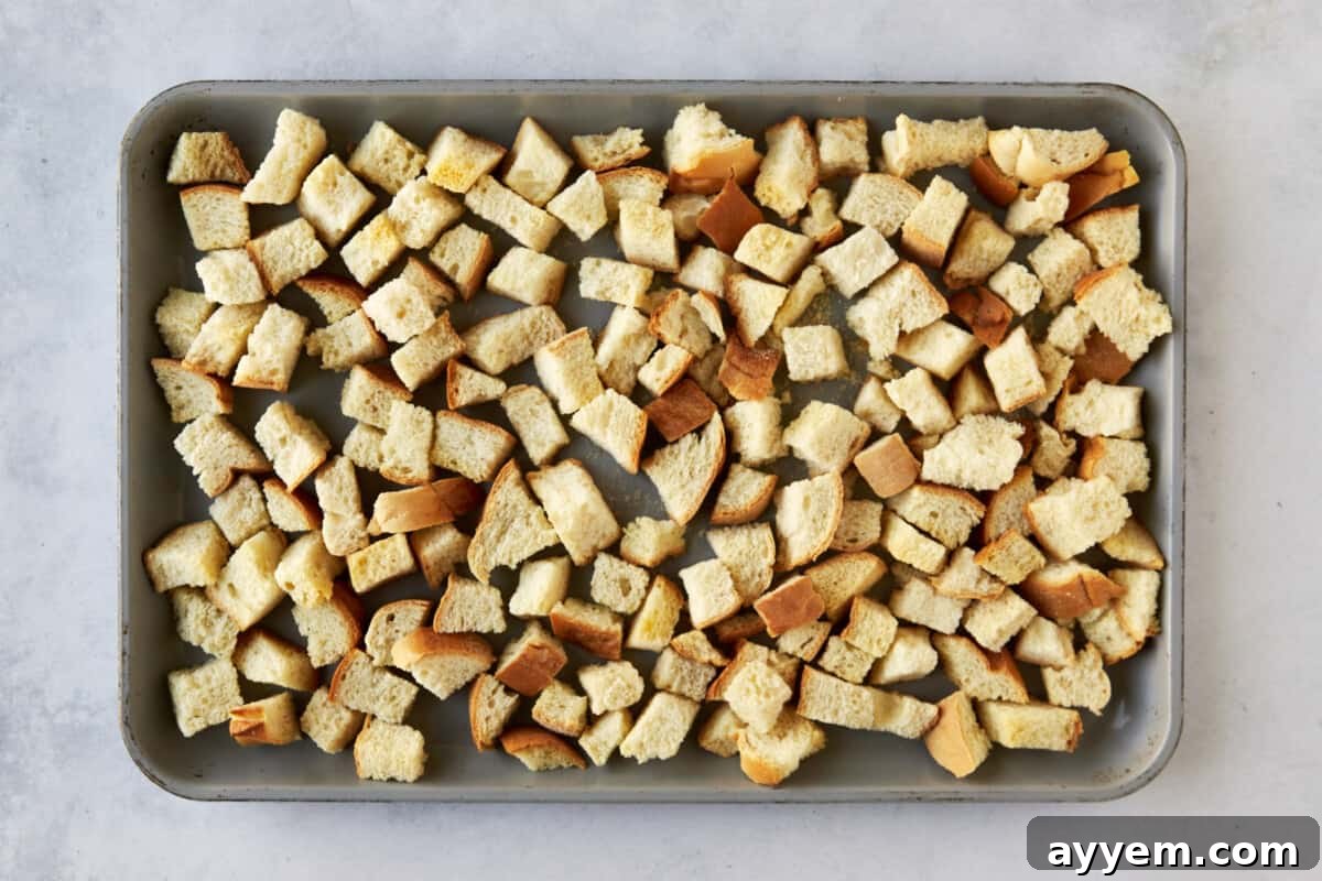 Bread pieces on a baking dish.