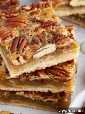 Delectable Pecan Pie Bars, showing a rich, gooey pecan filling on a shortbread crust.