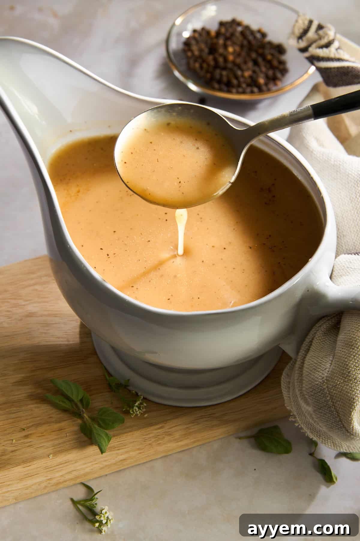 A serving of perfectly roasted turkey drizzled with rich, homemade turkey gravy.