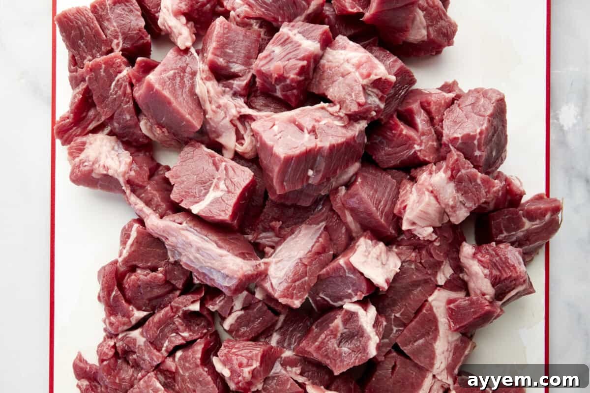 Raw cubes of stew meat, ready for the slow cooker.