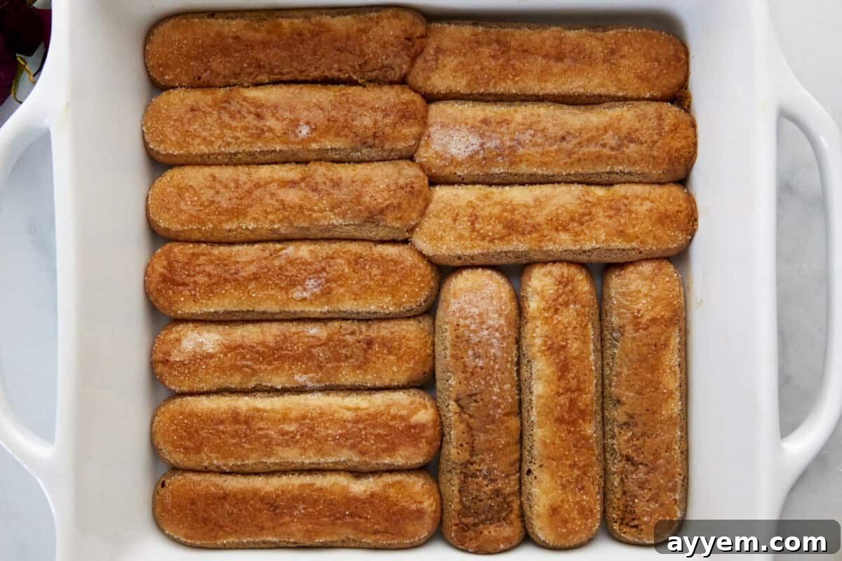 Coffee soaked ladyfingers in the bottom of a baking dish. 