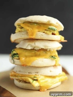 Three perfectly stacked protein-packed egg muffin sandwiches, ready for a nutritious breakfast.