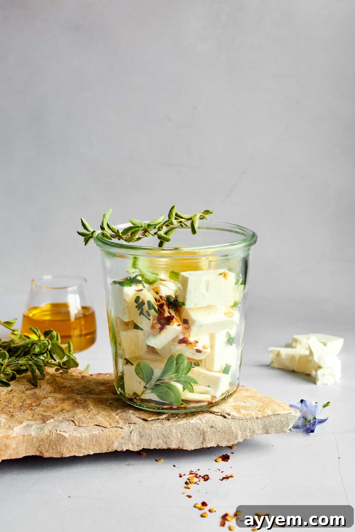 Feta cubes in a glass jar. 
