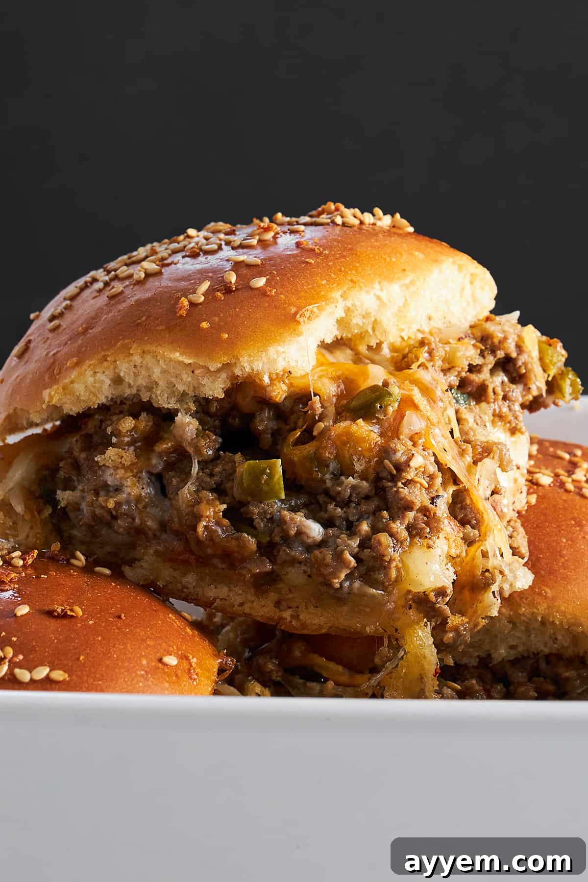 Side view of a cheeseburger slider. 