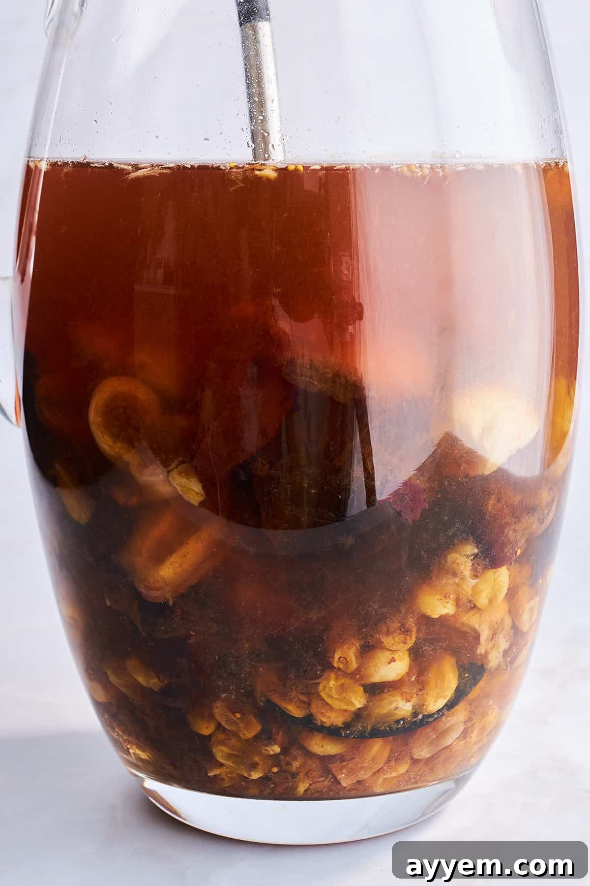 Close-up of a glass filled with vibrant dried fruit compote.