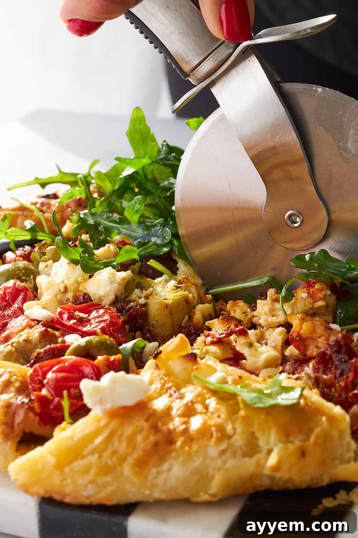 A top-down view of the Mediterranean Vegetable Galette, highlighting the rich colors and textures of the vegetables and cheese.