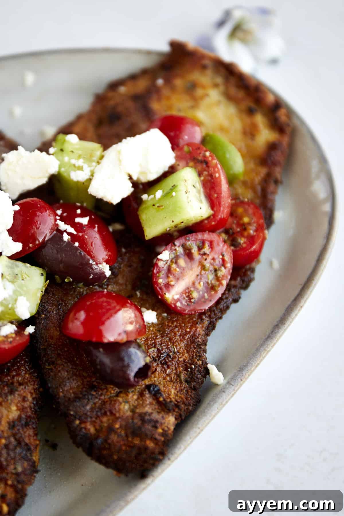 Chicken Milanese with Mediterranean Salad.