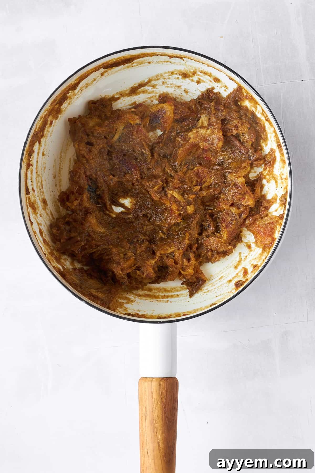Smooth, rich date paste cooling in a pot.
