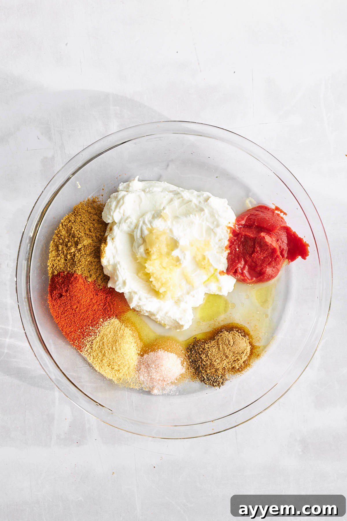 Ingredients for chicken shawarma marinade in a bowl.