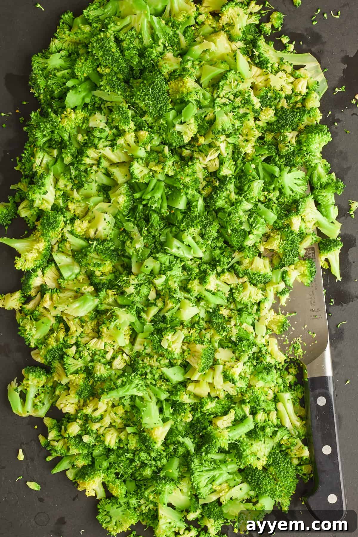 Freshly chopped broccoli florets in a bowl, ready for cooking.