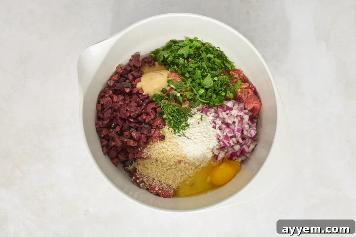 Mediterranean ground beef meatball ingredients in a bowl.