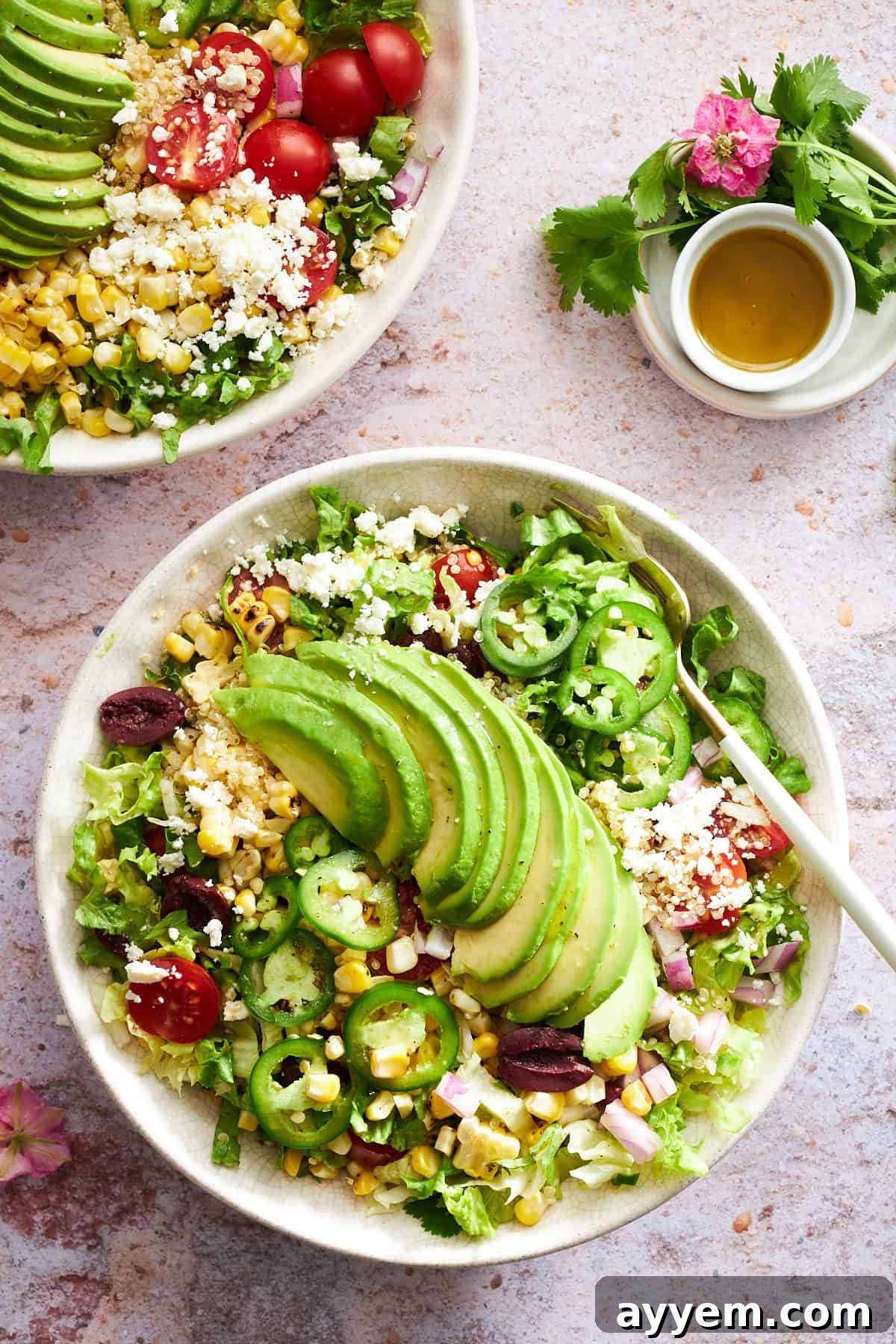 All the fresh ingredients for Mexican Quinoa Salad laid out, including cooked quinoa, colorful vegetables, and dressing components.