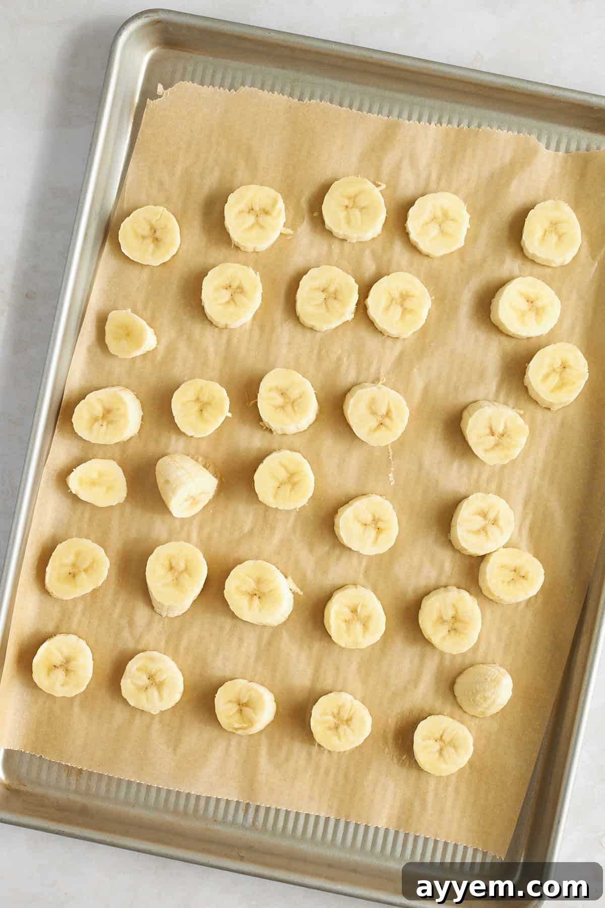 Ingredients for cottage cheese ice cream laid out: cottage cheese, frozen banana, frozen strawberries, and honey.