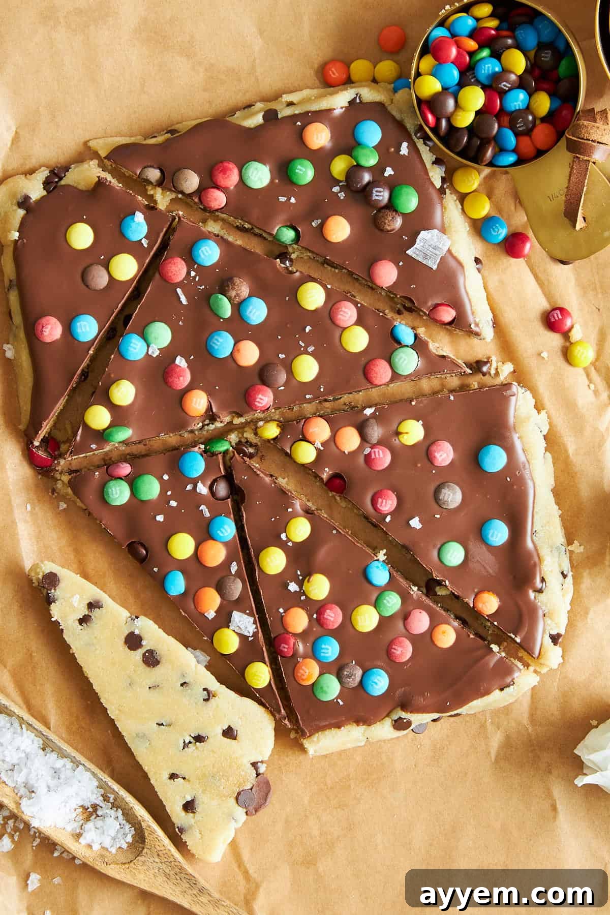 A slab of cookie dough bark cut into triangles.