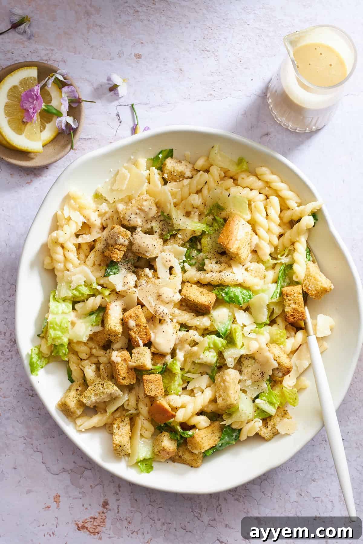 Zesty Caesar Pasta Bowl 5 A bowl of Caesar pasta salad.