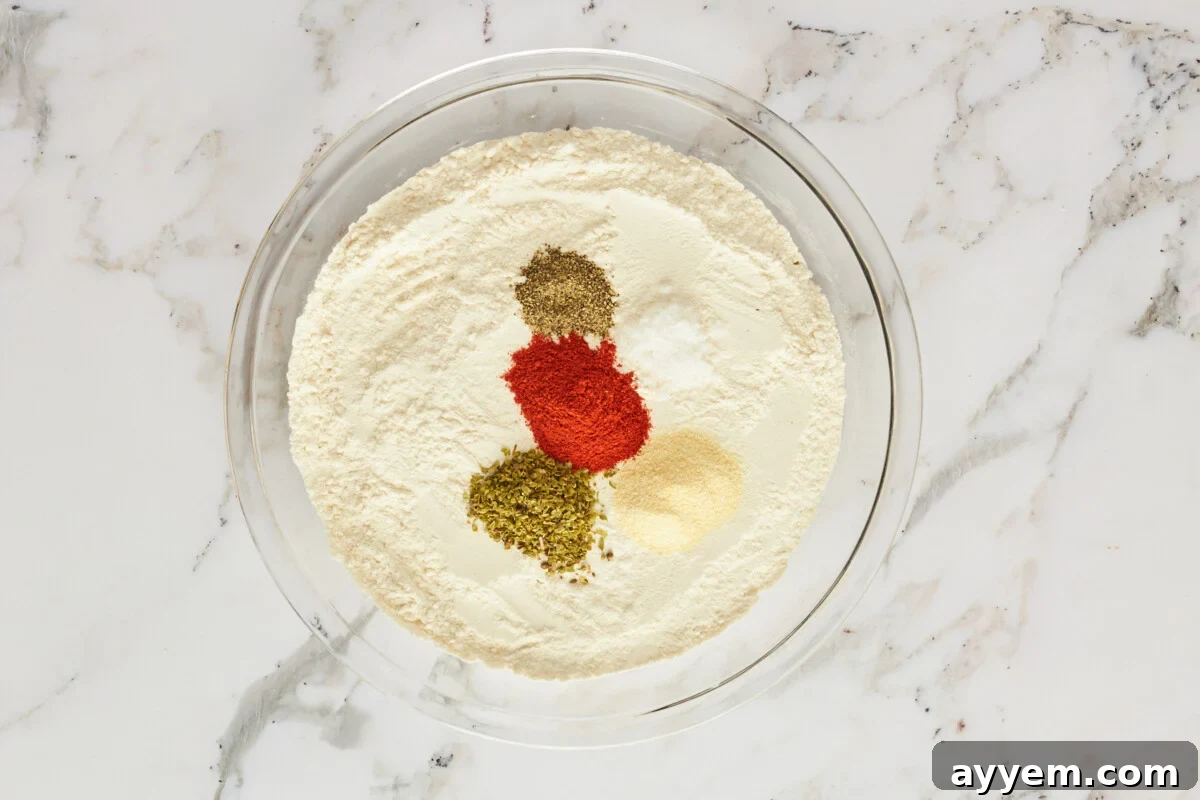 A bowl of flour and seasonings for breading.
