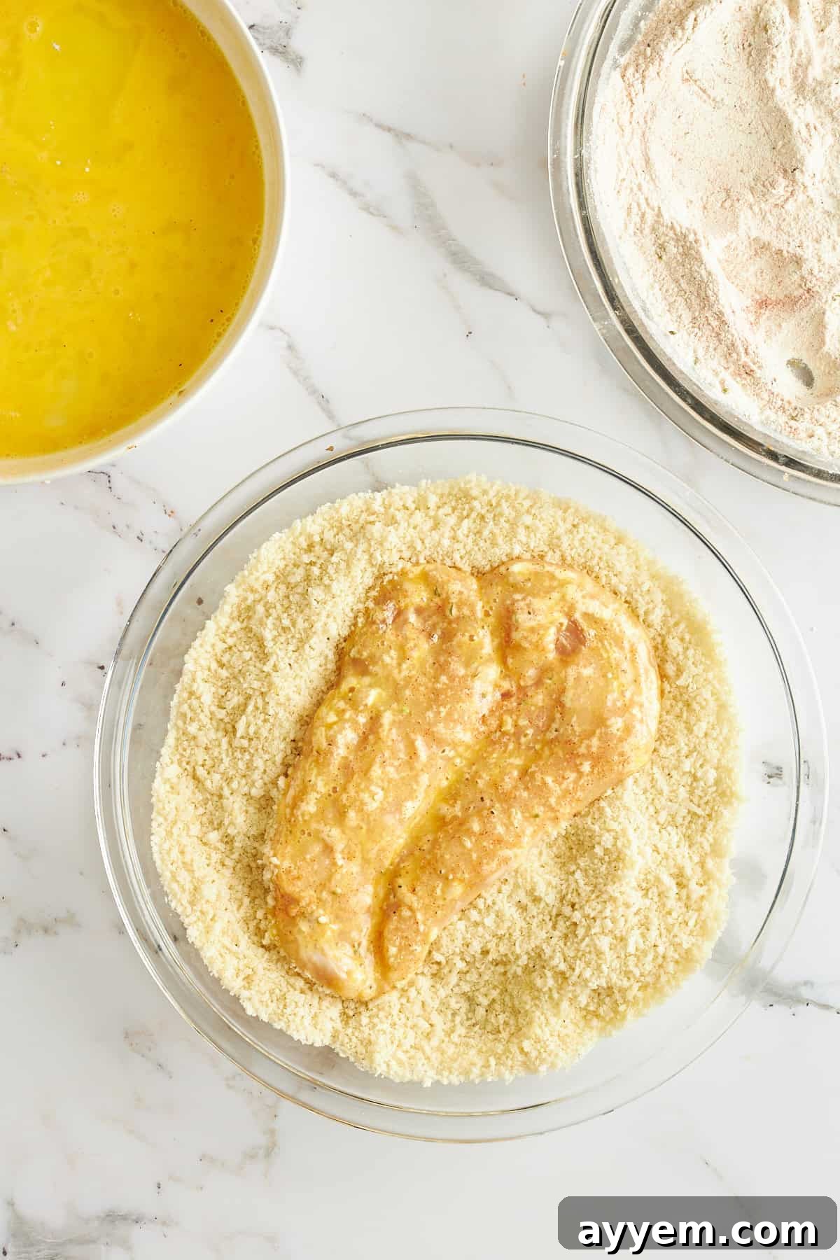 Golden Chicken Milanese with Zesty Caesar Salad 8 Raw chicken cutlet generously coated in a mixture of seasoned panko breadcrumbs and Parmesan cheese.