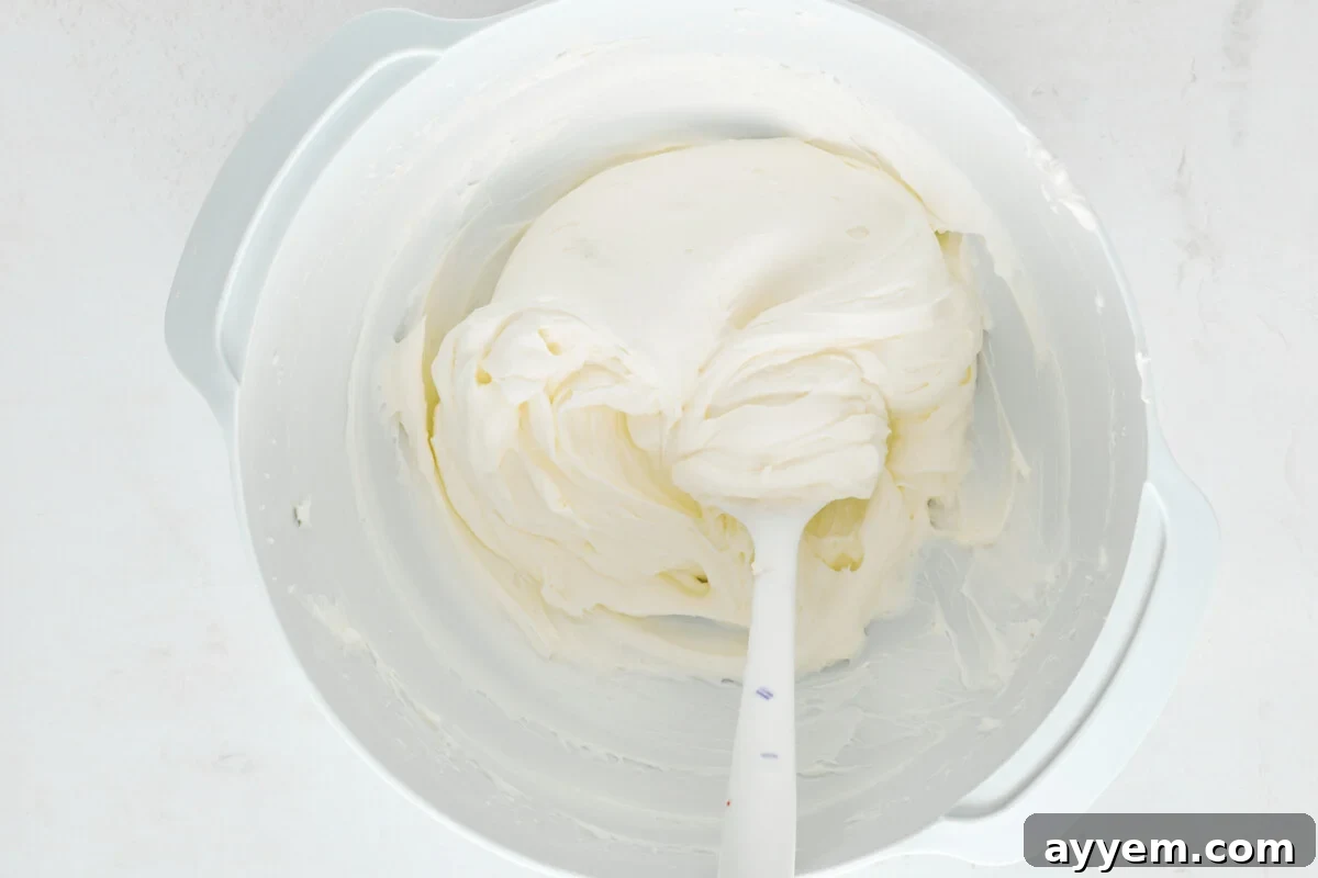 Cheesecake filling in a mixing bowl.